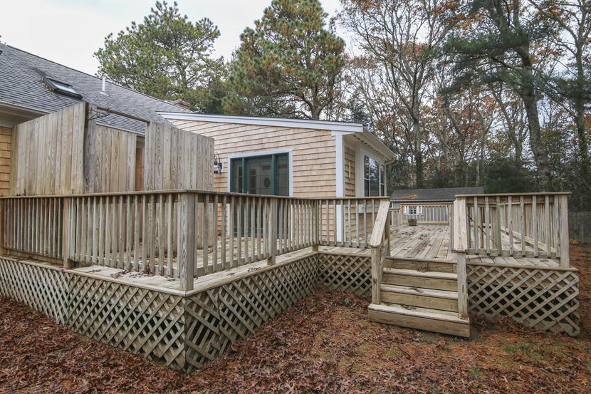 18 Sandy Valley Road Marstons Mills, MA 02648 - Photo 22 of 25 a view of a chair on the deck