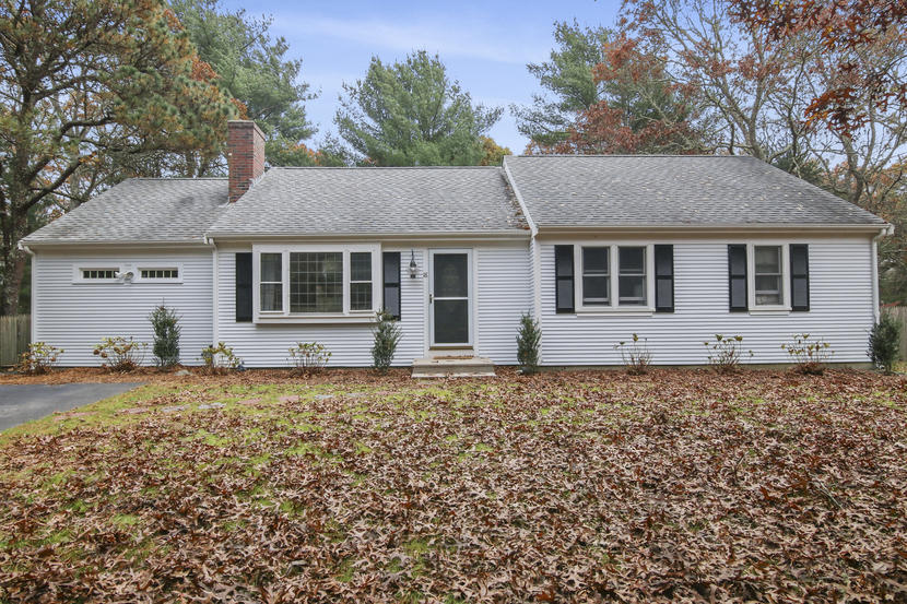 18 Sandy Valley Road Marstons Mills, MA 02648 - Photo 24 of 25 a house with trees in the background