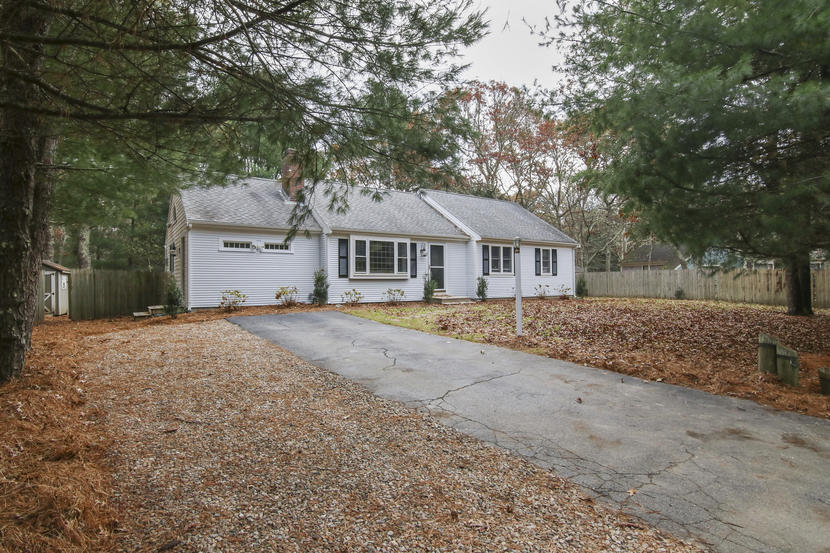 18 Sandy Valley Road Marstons Mills, MA 02648 - Photo 25 of 25 a house with trees in the background