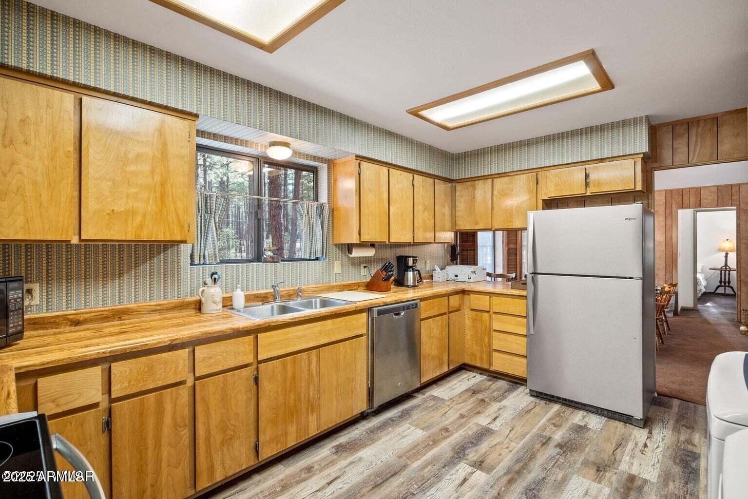 4 County Road 2089 Alpine, AZ 85920 - Photo 25 of 48 a kitchen with a sink refrigerator and window