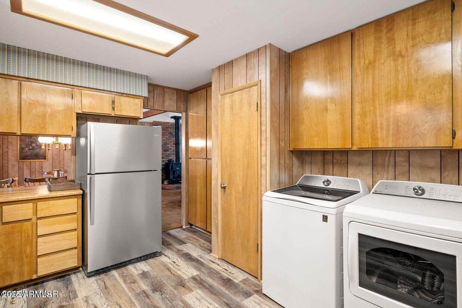 4 County Road 2089 Alpine, AZ 85920 - Photo 26 of 48 a kitchen with a refrigerator a stove a washer and dryer