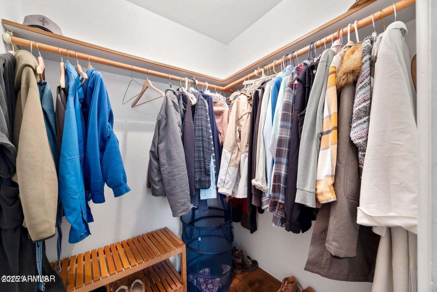 4 County Road 2089 Alpine, AZ 85920 - Photo 29 of 48 a view of walk in closet with clothes and shoes