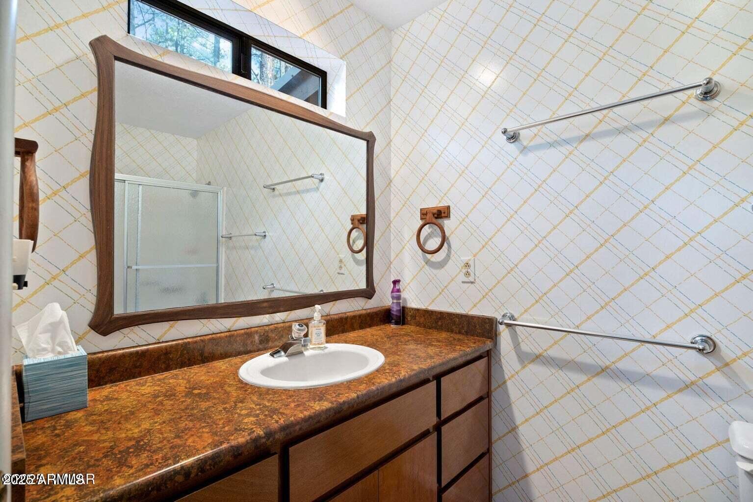 4 County Road 2089 Alpine, AZ 85920 - Photo 30 of 48 a bathroom with a sink and a mirror