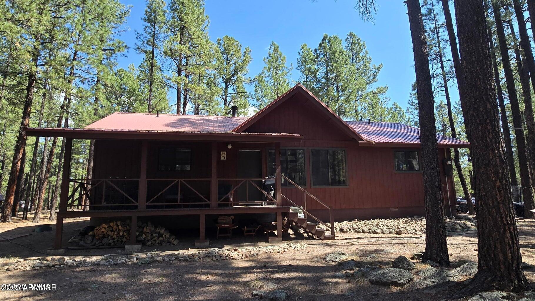 4 County Road 2089 Alpine, AZ 85920 - Photo 3 of 48 a front view of a house with parking space