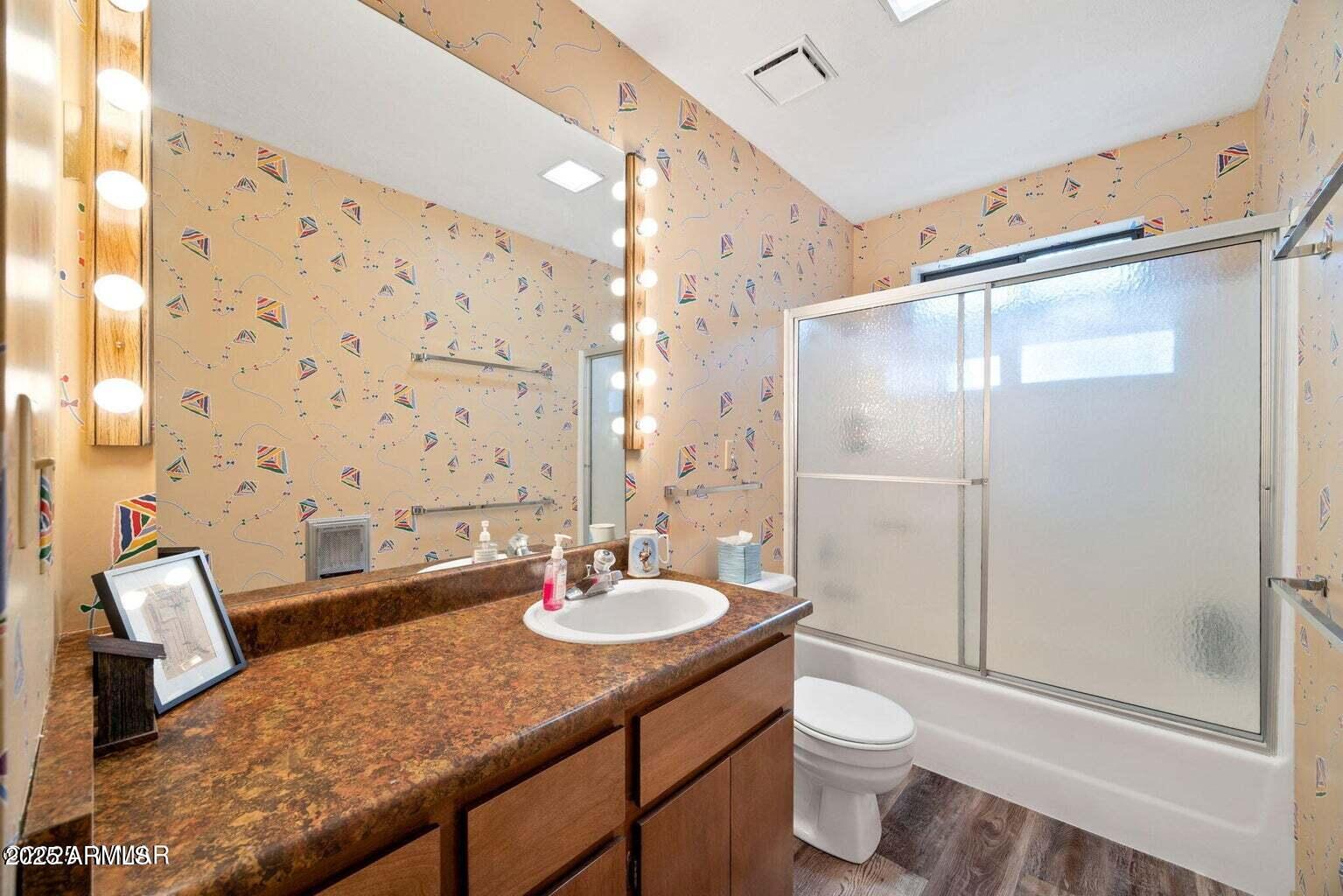 4 County Road 2089 Alpine, AZ 85920 - Photo 34 of 48 a bathroom with a granite countertop sink toilet and shower