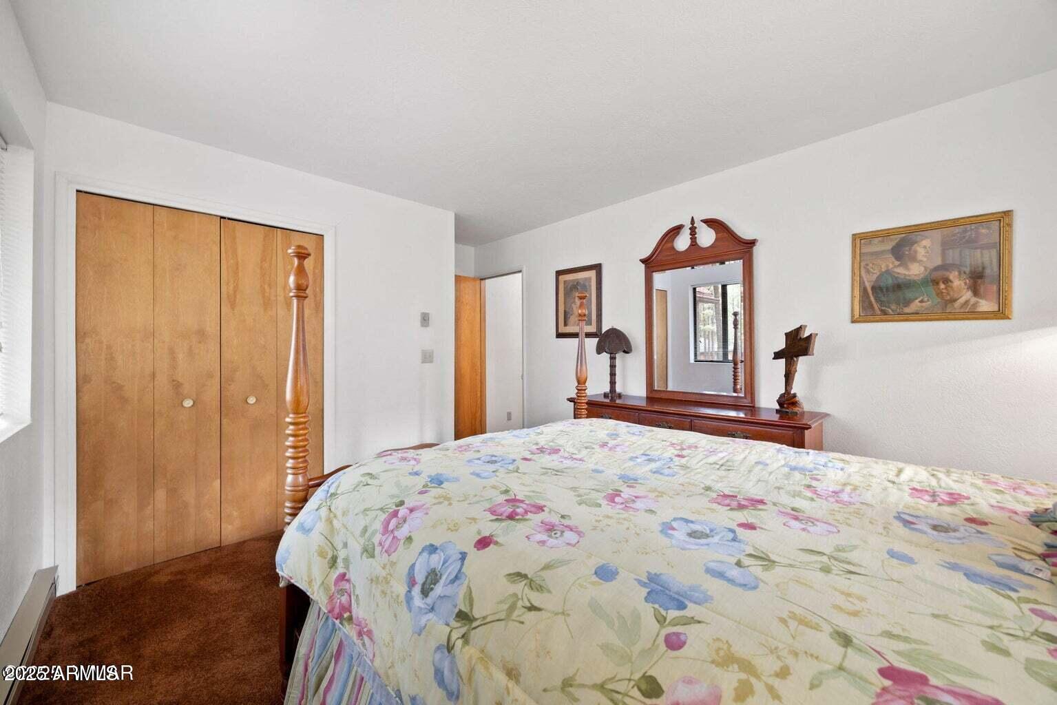 4 County Road 2089 Alpine, AZ 85920 - Photo 36 of 48 a bedroom with a bed and a window