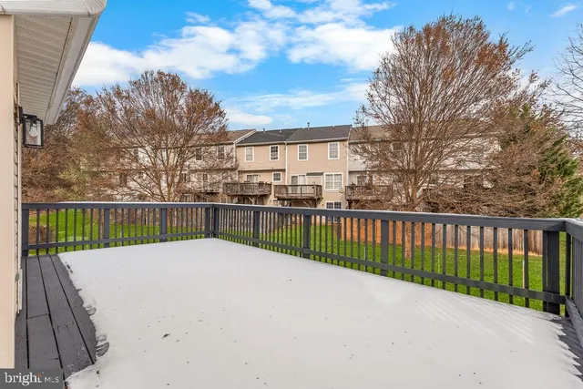 a view of a fence and a trees in the background