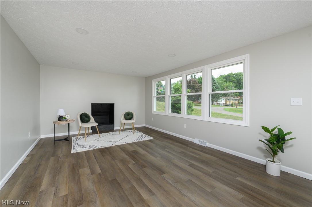 4855 4th Street Northwest Canton, OH 44708 - Photo 8 of 25 Unfurnished room featuring dark hardwood / wood-style flooring and a textured ceiling
