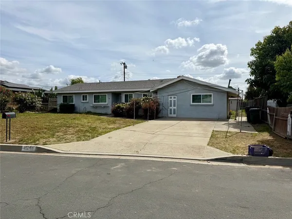 a view of a house with a flower garden
