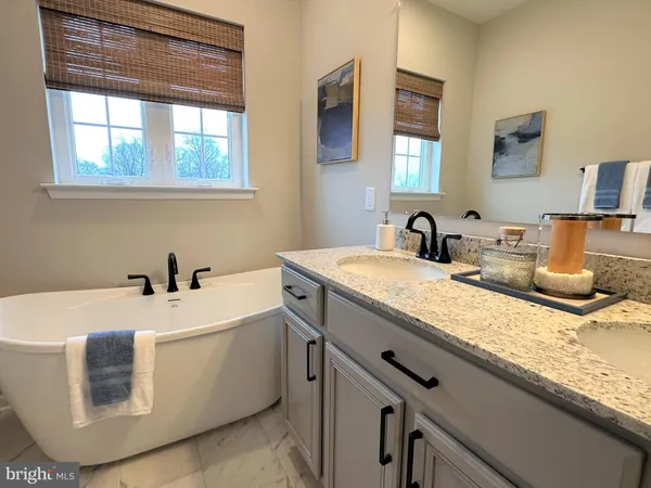 a bathroom with a sink and a bathtub