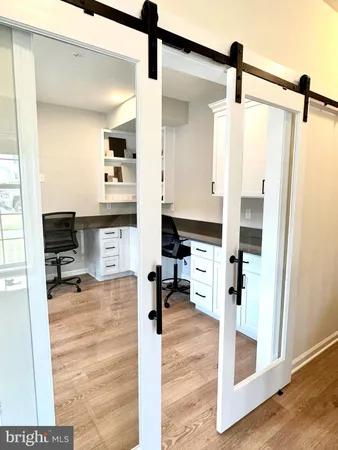 a view of a living room and hardwood floor