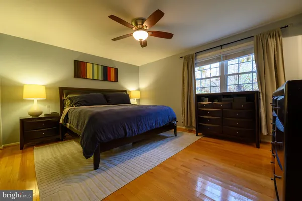 a bedroom with a bed and a tv