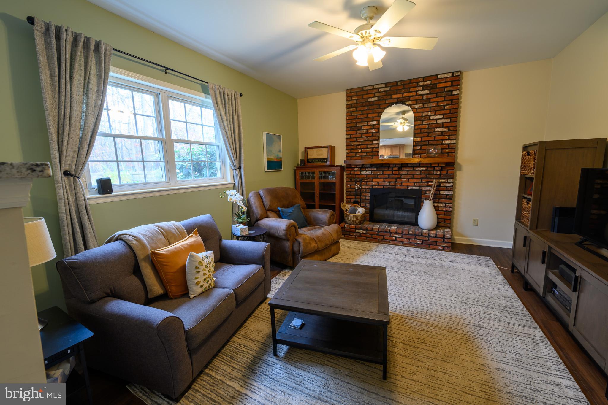 653 McKendimen Road Shamong, NJ 08088 - Photo 8 of 13 a living room with fireplace furniture and a flat screen tv