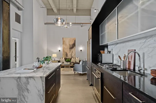 a kitchen with sink refrigerator and stove