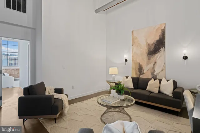 a living room with furniture and a table