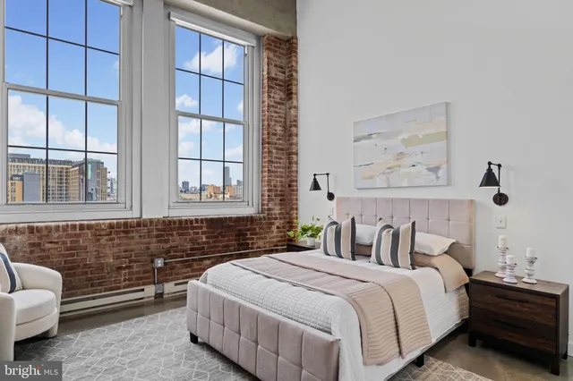 a bedroom with bed and a window