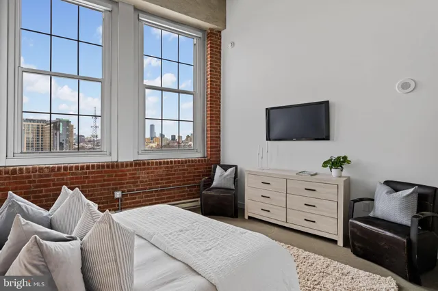 a bedroom with a bed and furniture