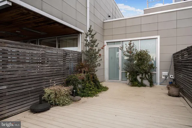 a view of house with backyard and sitting area