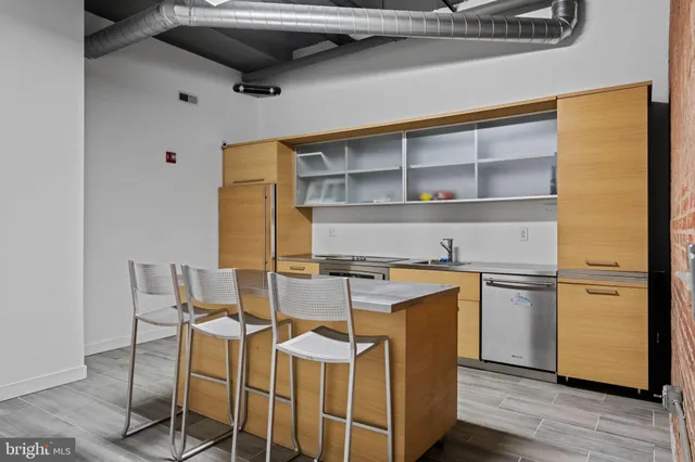 a kitchen with stainless steel appliances granite countertop a stove and a refrigerator