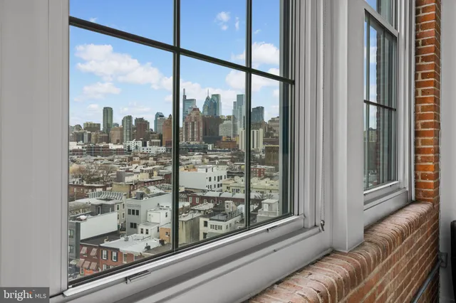 a view of a living room filled with furniture