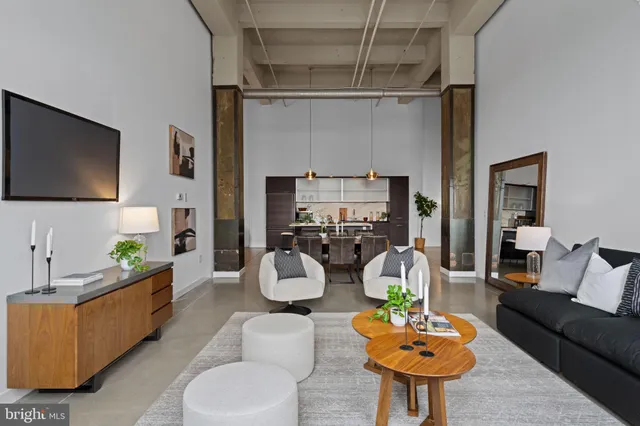 a living room with furniture and a flat screen tv