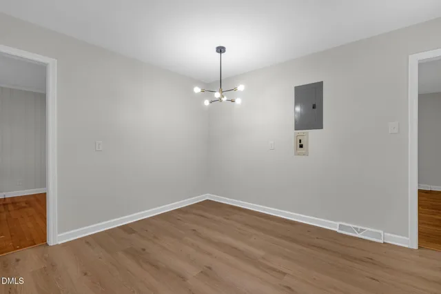 a view of a balcony with wooden floor and fence