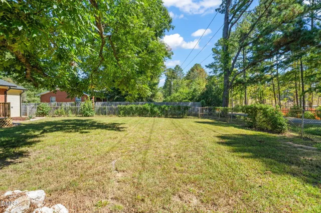 a view of yard along with trees