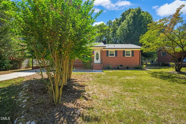 a view of a back yard with a patio