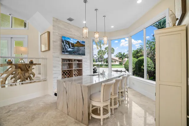 a living room with fireplace furniture and a flat screen tv