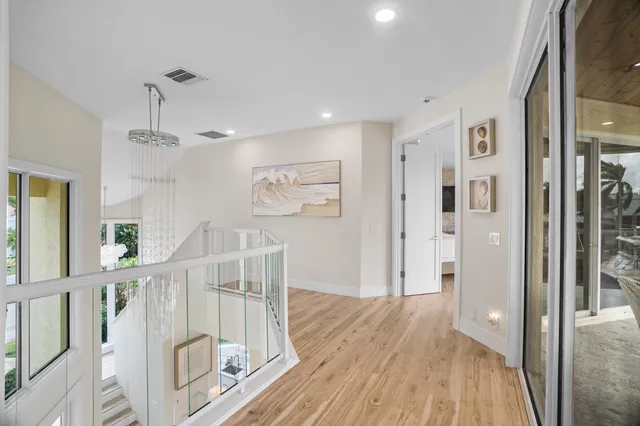 a view of a living room with hardwood floor and a window