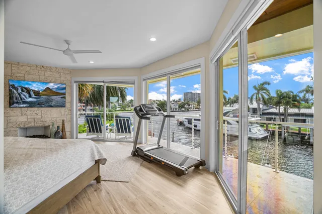 a living room with fireplace furniture and a flat screen tv