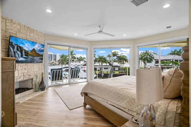 a large bathroom with a granite countertop tub a double vanity sink a large mirror and a shower