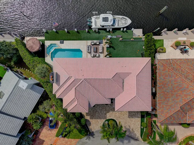 an aerial view of a house roof deck and outdoor seating