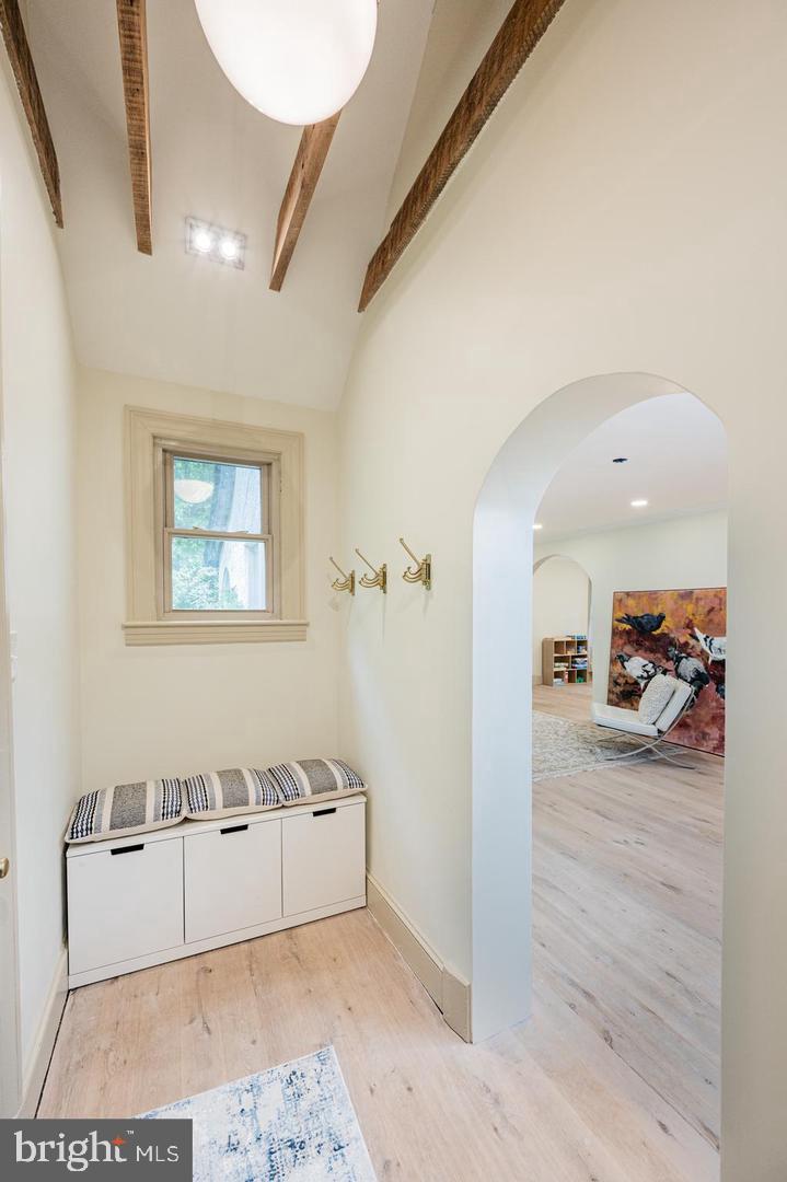 2244 Crest Road Baltimore, MD 21209 - Photo 13 of 54 a view of a livingroom with wooden floor and a ceiling fan