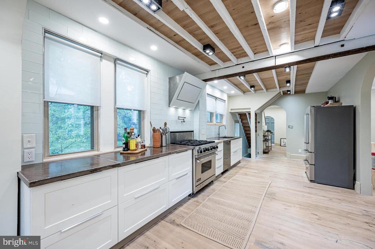 2244 Crest Road Baltimore, MD 21209 - Photo 21 of 54 a large white kitchen with a large window