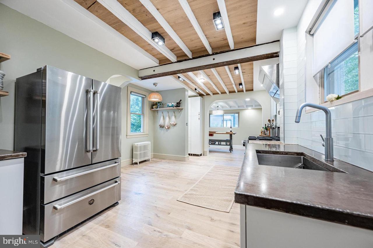 2244 Crest Road Baltimore, MD 21209 - Photo 24 of 54 a kitchen with sink refrigerator and cabinets