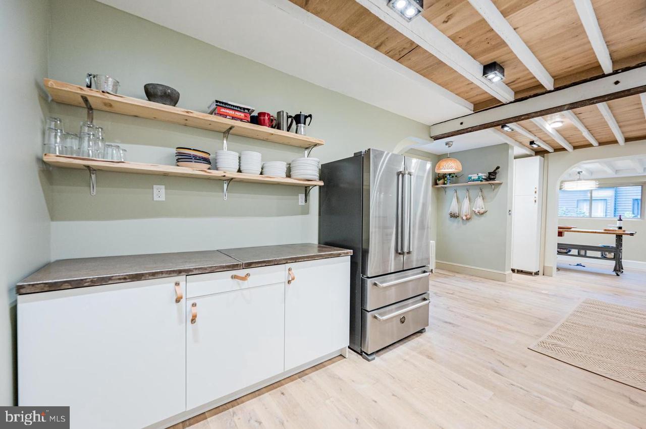 2244 Crest Road Baltimore, MD 21209 - Photo 25 of 54 a kitchen with stainless steel appliances cabinets and a refrigerator