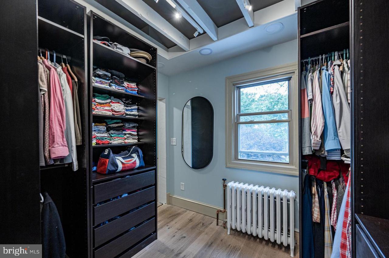 2244 Crest Road Baltimore, MD 21209 - Photo 35 of 54 a view of walk in closet with clothes and shoes