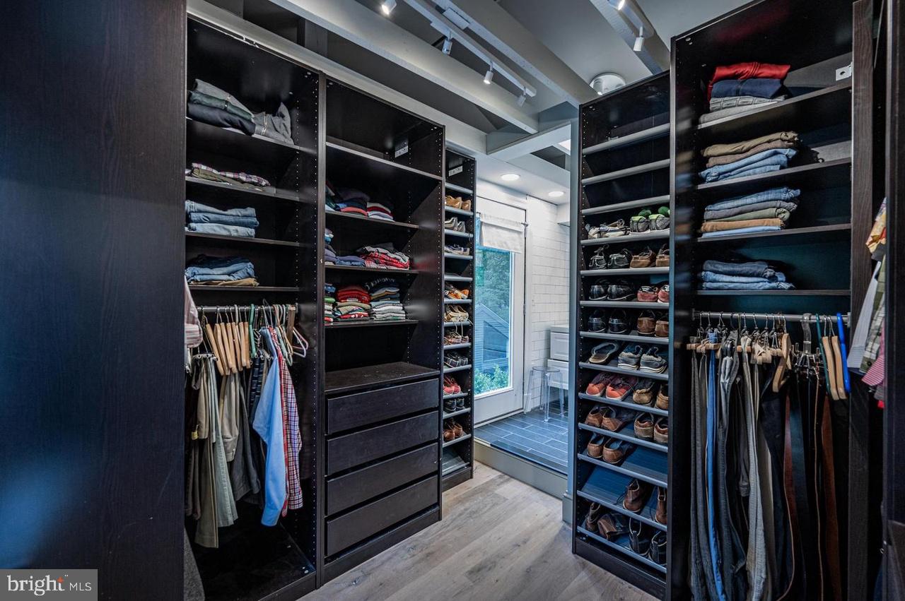 2244 Crest Road Baltimore, MD 21209 - Photo 36 of 54 a view of walk in closet with clothes and shoes