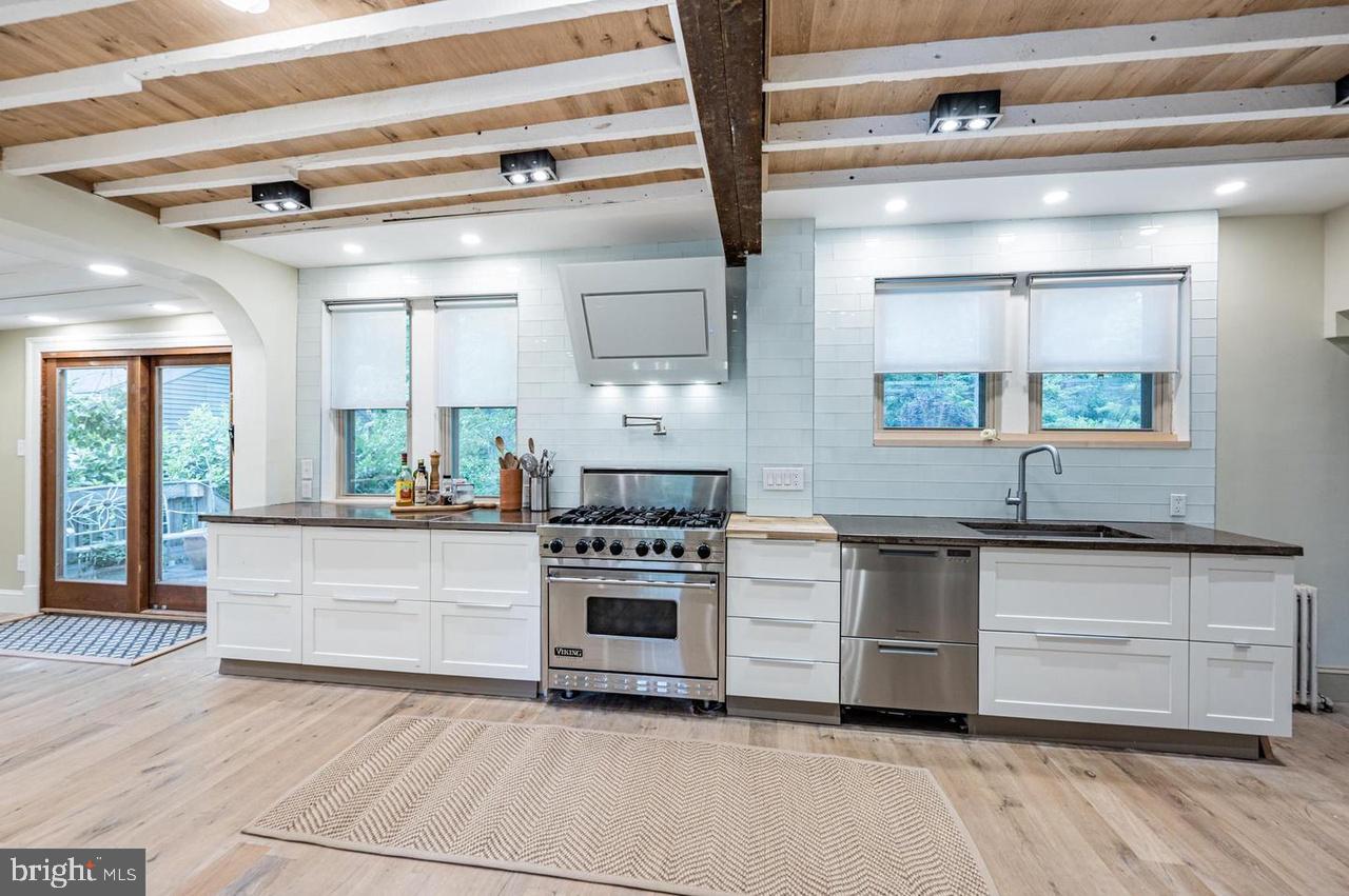 2244 Crest Road Baltimore, MD 21209 - Photo 5 of 54 a kitchen with stainless steel appliances granite countertop a stove and a sink