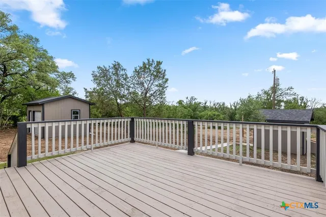 a view of deck with wooden floor and fence