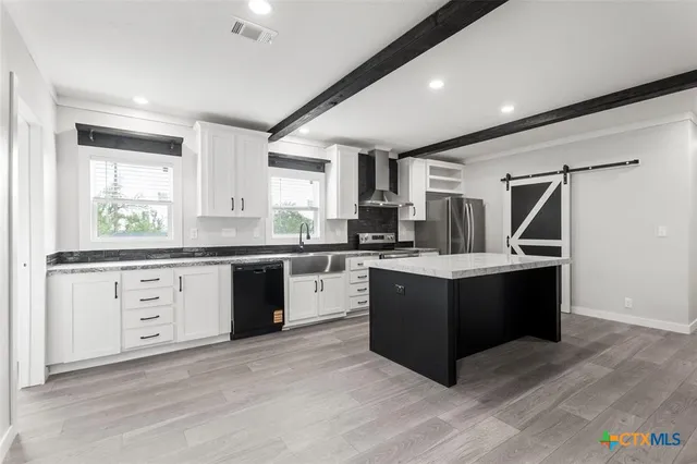 a kitchen with a cabinets and counter space