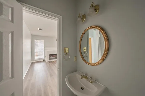 a bathroom with a sink and a mirror