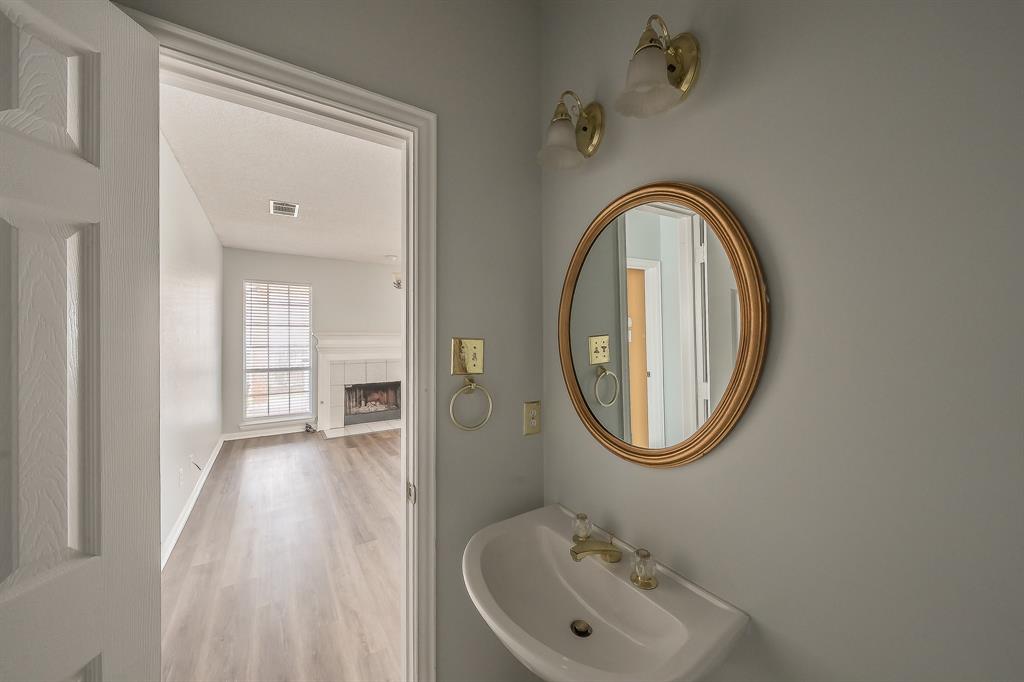 2643 Garden Ridge Lane Arlington, TX 76006 - Photo 17 of 40 a bathroom with a sink and a mirror
