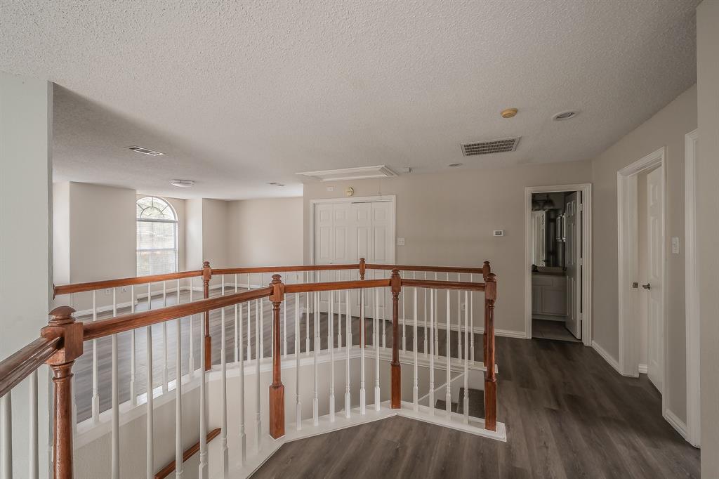 2643 Garden Ridge Lane Arlington, TX 76006 - Photo 30 of 40 a view of hallway with wooden floor