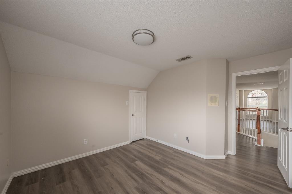 2643 Garden Ridge Lane Arlington, TX 76006 - Photo 36 of 40 a view of a livingroom with wooden floor and a couch