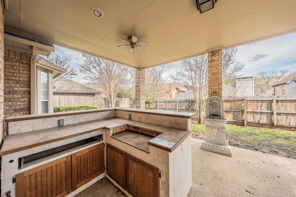 2643 Garden Ridge Lane Arlington, TX 76006 - Photo 39 of 40 a view of a kitchen with a sink and a large window