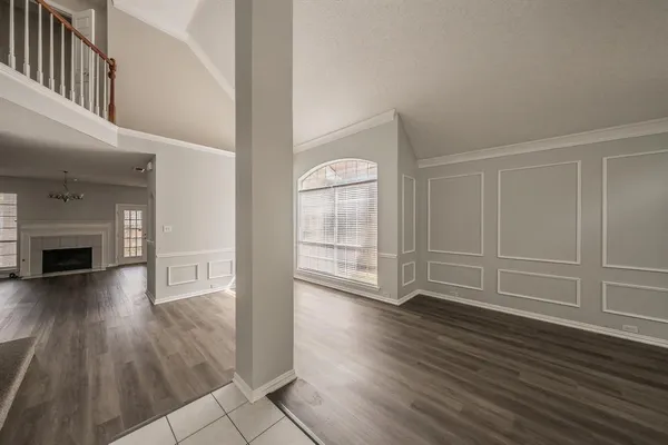 wooden floor in an empty room with a fireplace