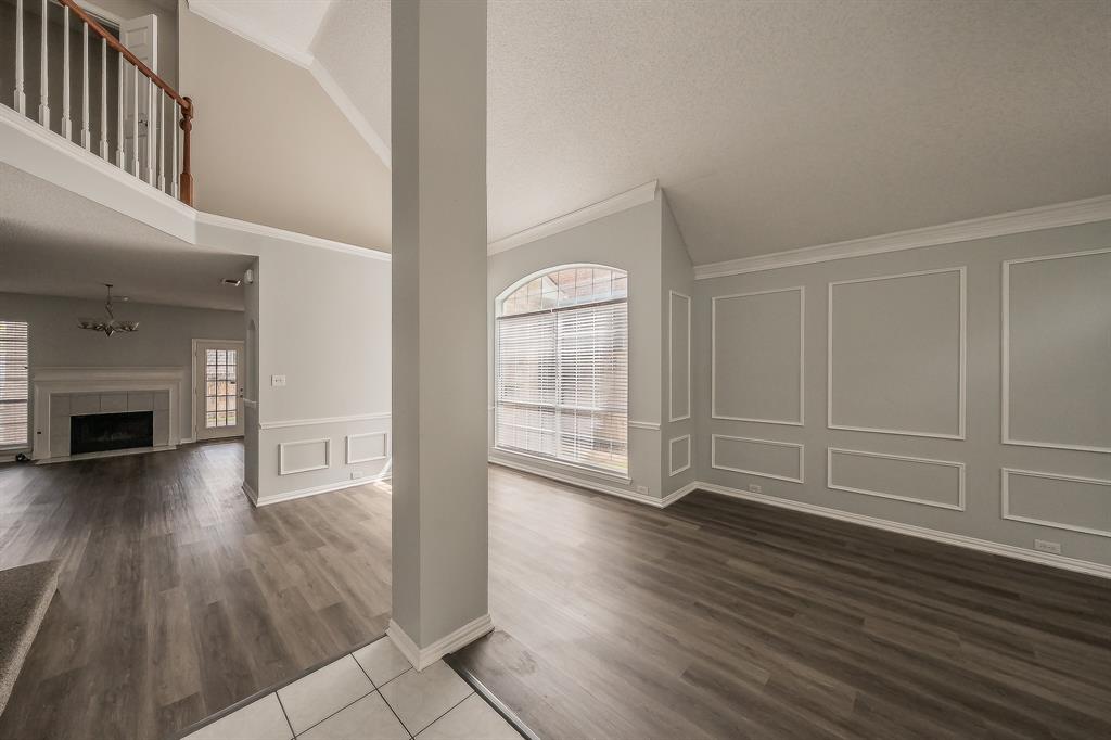 2643 Garden Ridge Lane Arlington, TX 76006 - Photo 4 of 40 wooden floor in an empty room with a fireplace