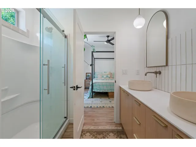 a bathroom with a sink double vanity and a mirror